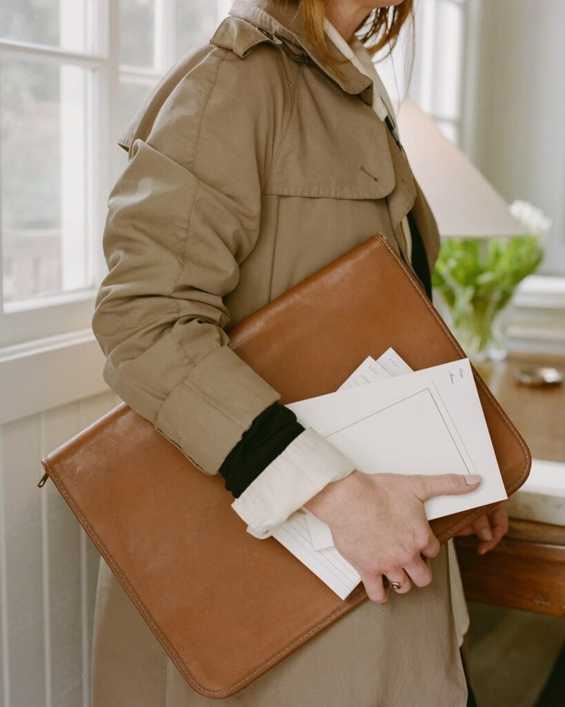 a lady carrying document