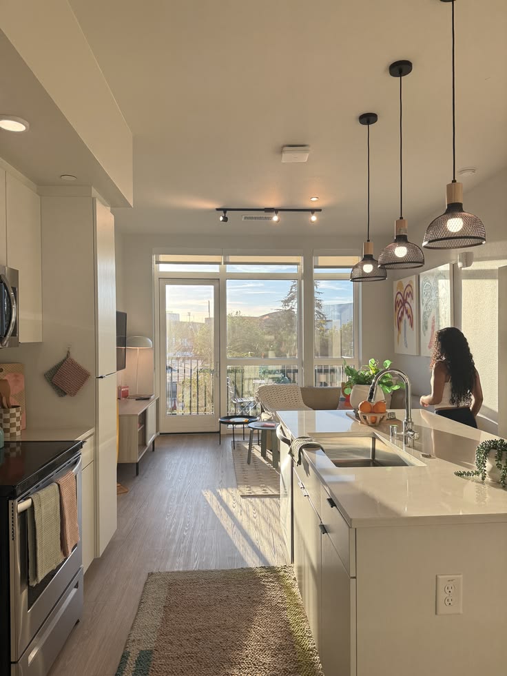 a lady walking around the apartment