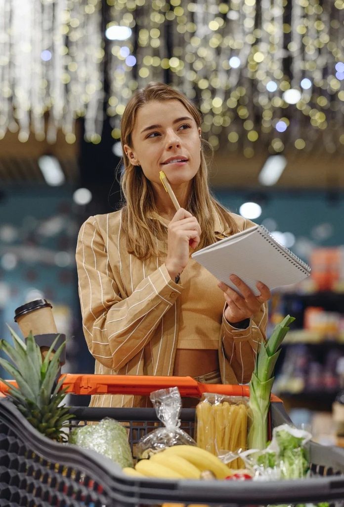 lady being thoughtful while shopping as regards to save money on an entry-level salary