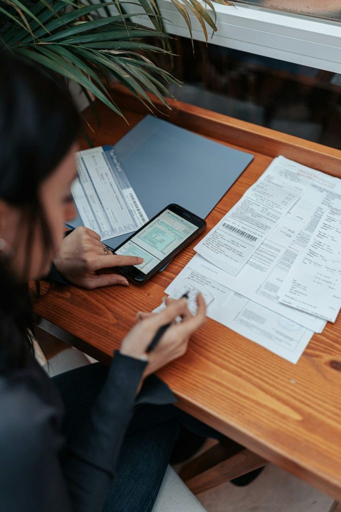 someone reviewing documents  as regards to things to know about your first paycheck
