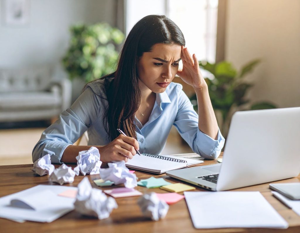 Young professional solving problem at work as regards to how to handle workplace mistakes professionally