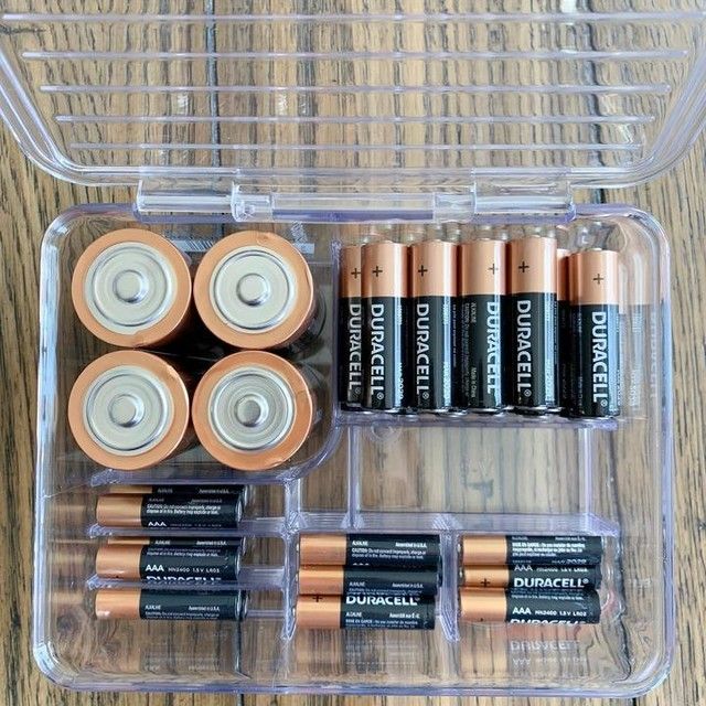 A few household batteries stored neatly in a small box