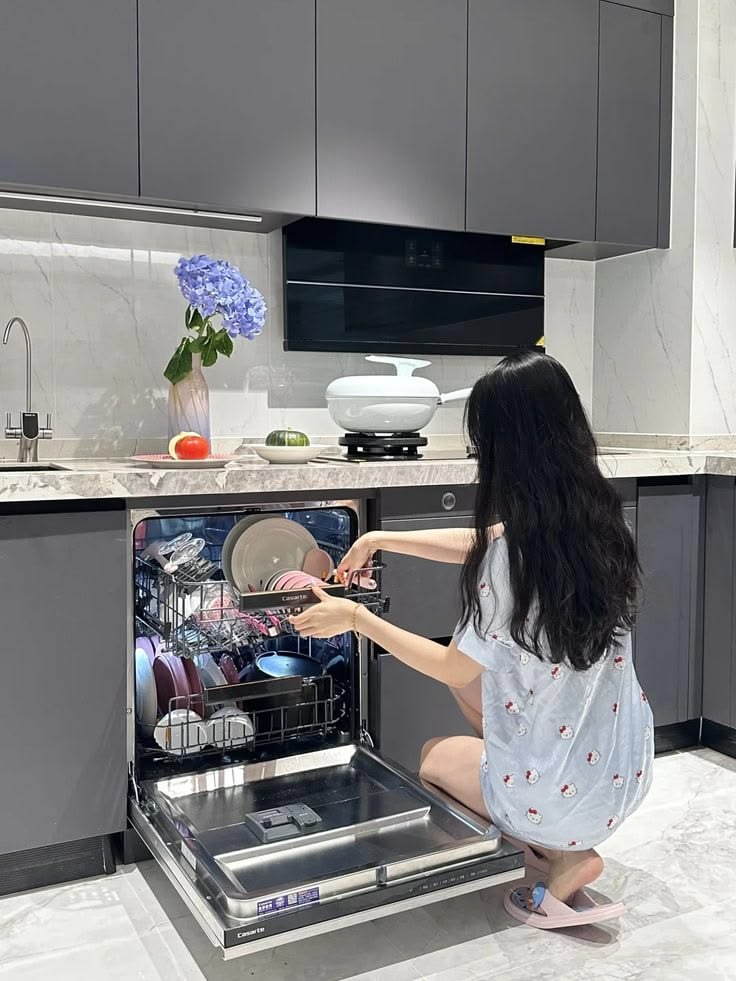 lady arranging the kitchen wares