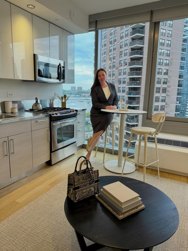 a lady sitting in a nice apartment 