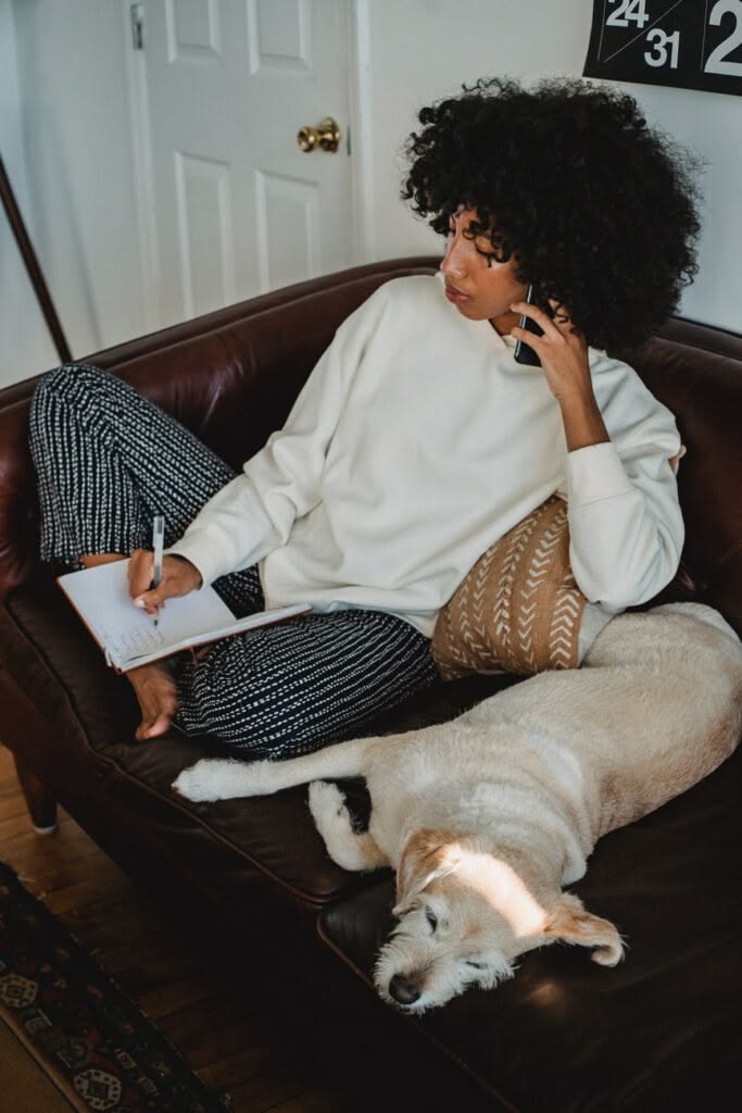 a young lady on a phone call sitting down